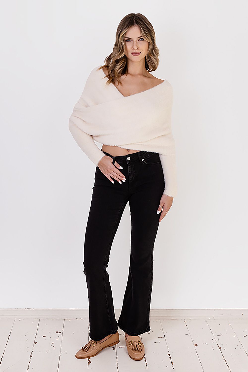 Fashionable MKM Bristle Yarn Jumper sweater, offering cozy comfort with a striking deep neckline, ideal for luxury winter fashion.