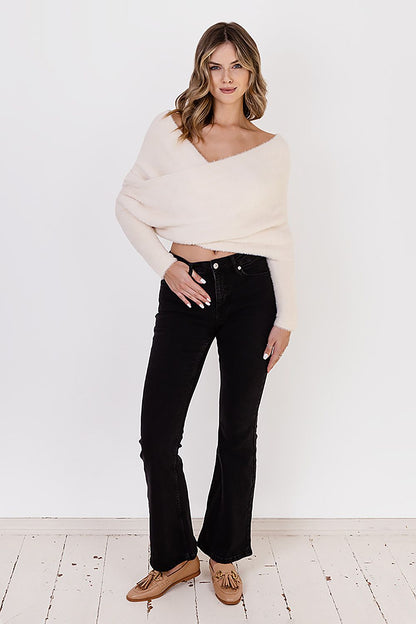 Fashionable MKM Bristle Yarn Jumper sweater, offering cozy comfort with a striking deep neckline, ideal for luxury winter fashion.