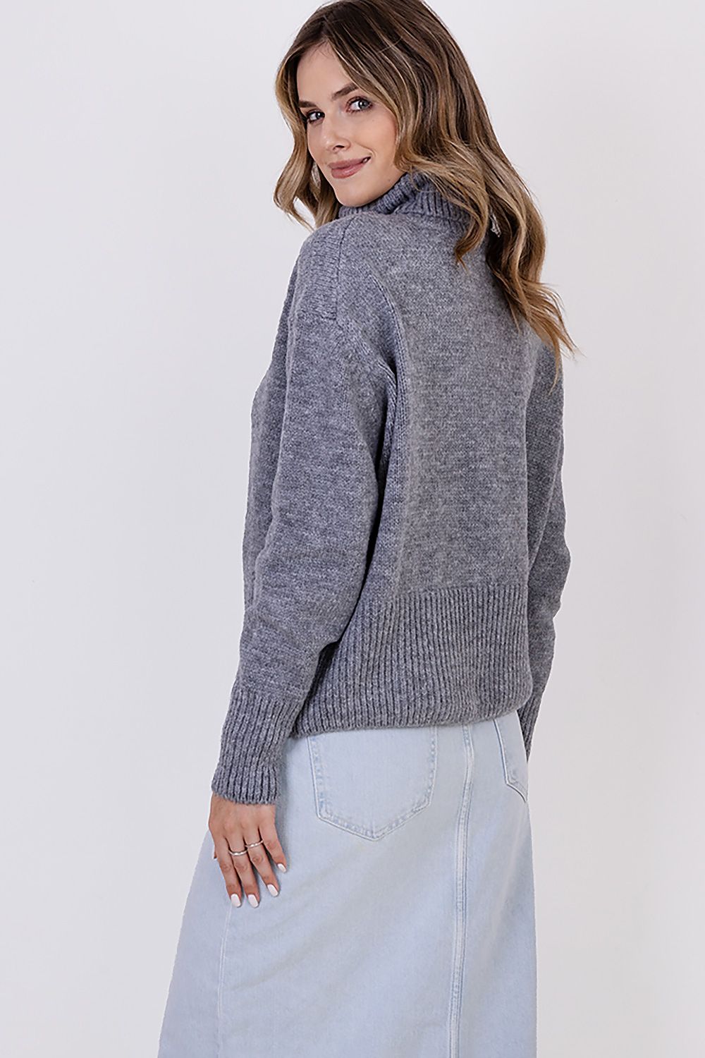 MKM Elegant Soft Turtleneck Sweater styled with minimalistic jeans and accessories, epitomising versatility and chic casual fashion.