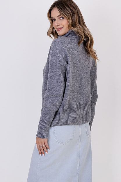 MKM Elegant Soft Turtleneck Sweater styled with minimalistic jeans and accessories, epitomising versatility and chic casual fashion.