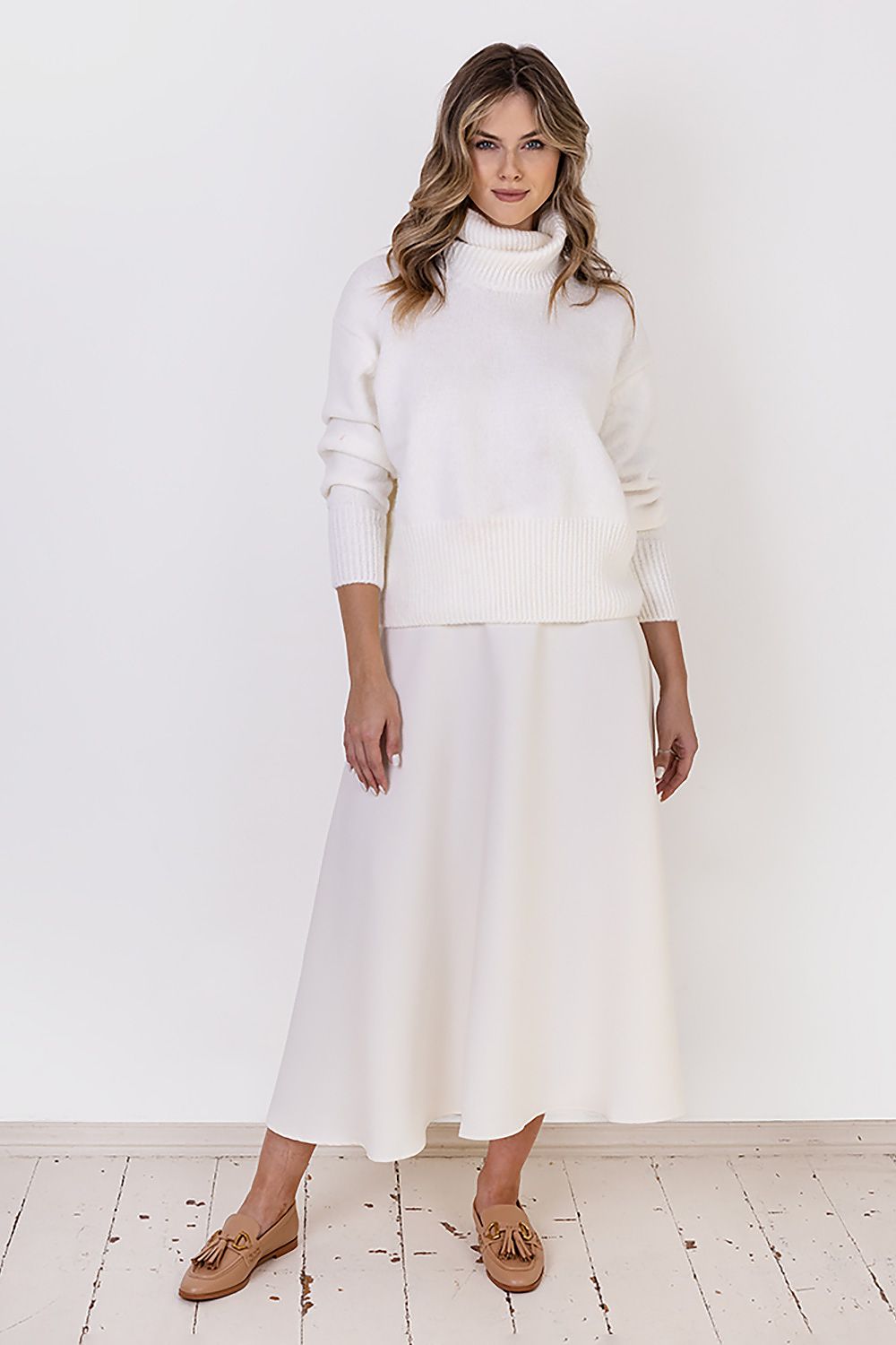 Casual outfit featuring MKM Elegant Turtleneck Sweater paired with stylish jeans and accessories.