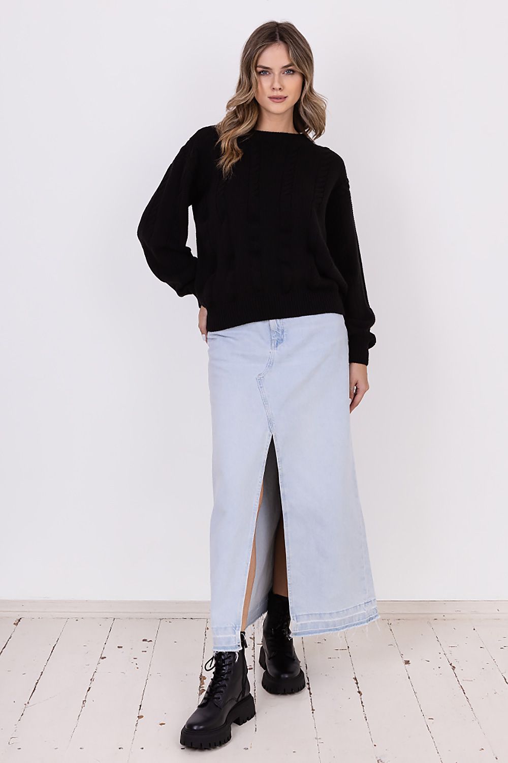 Side view of MKM women's jumper, emphasizing the flowing wide sleeves and unique vertical half-quartz pattern for an elegant silhouette.