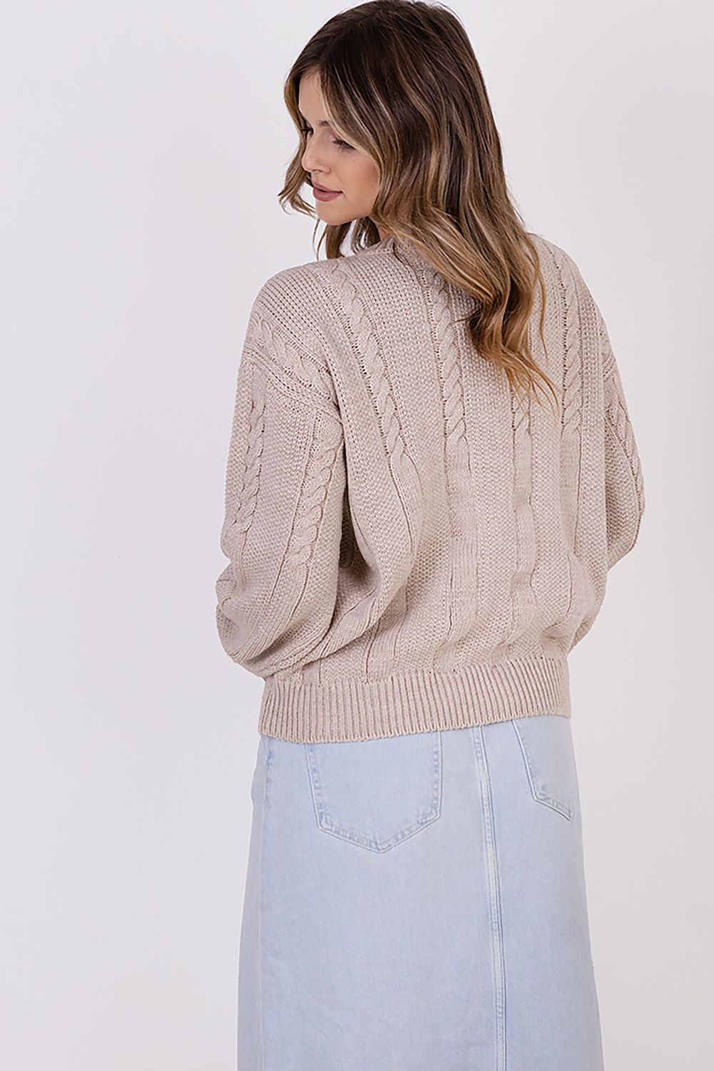 Close-up of MKM's high-quality wool blend women's jumper with wide sleeves, featuring a unique vertical half-quartz design, perfect for adding a touch of luxury to any outfit.