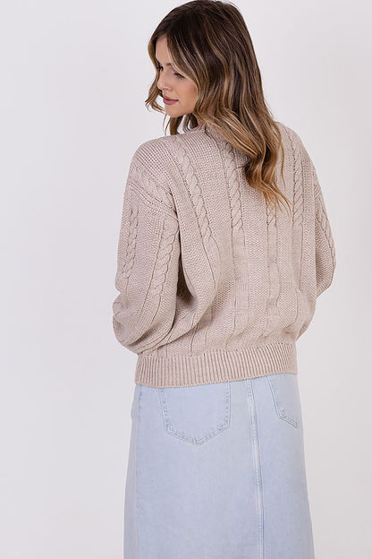 Close-up of MKM's high-quality wool blend women's jumper with wide sleeves, featuring a unique vertical half-quartz design, perfect for adding a touch of luxury to any outfit.