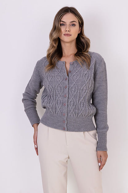 Close-up of MKM fashionable cardigan showcasing intricate decorative weaves and ribbed cuffs, epitomising modern elegance.