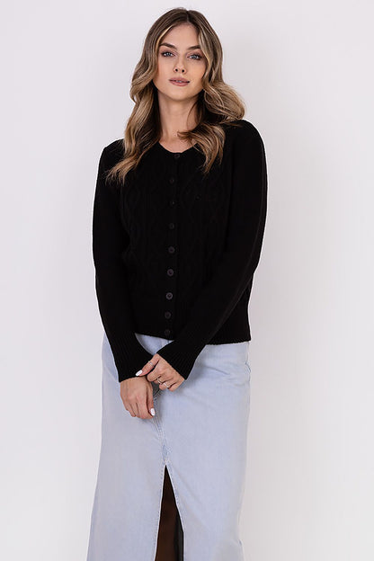 MKM luxurious cardigan in a sophisticated setting, emphasising its stylish design and premium fabric blend for ultimate comfort.