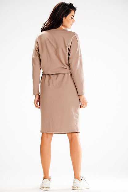Front view of Awama's elegant loose daydress with pockets and intricate applique design.