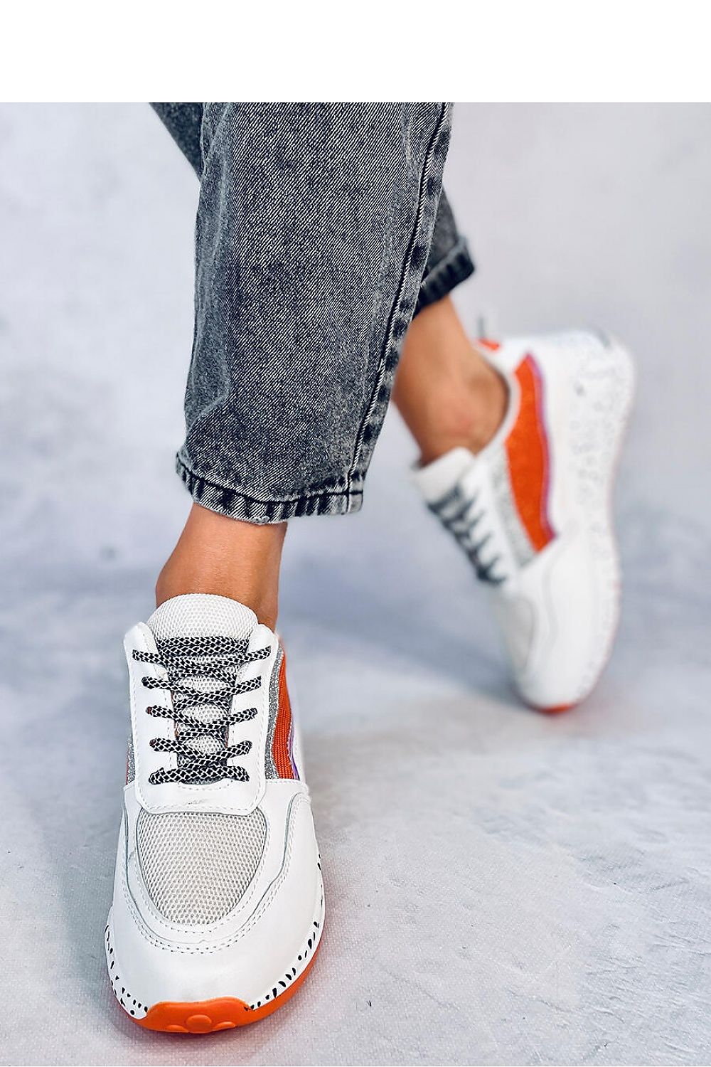 Close-up view of Inello's high sole luxury sports shoes, showcasing the shimmering glitter and unique snake skin pattern, perfect for a glamorous and trendy look.