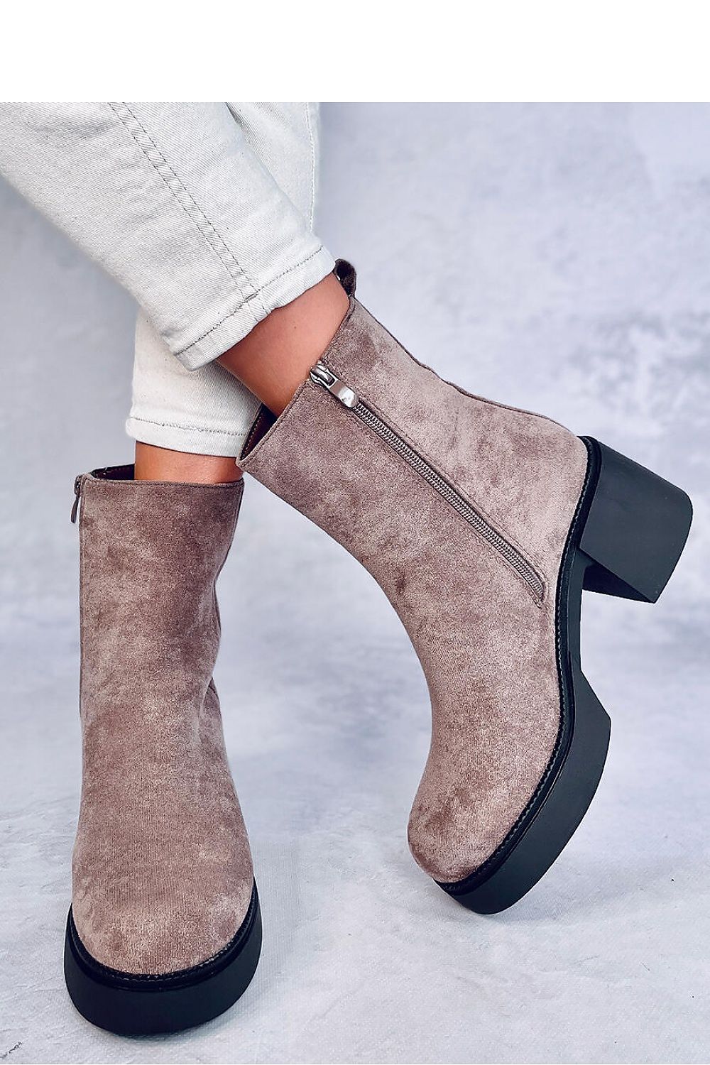 Elegant women's heel boots by Inello, showcasing a 6.5cm wide heel and 2cm platform, made from eco-friendly suede.