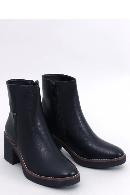 Inello Women's Classic Heel Boots featuring 7 cm rubber heel, crafted from organic leather with a luxurious soft fur lining, showcasing a timeless rounded toe design.
