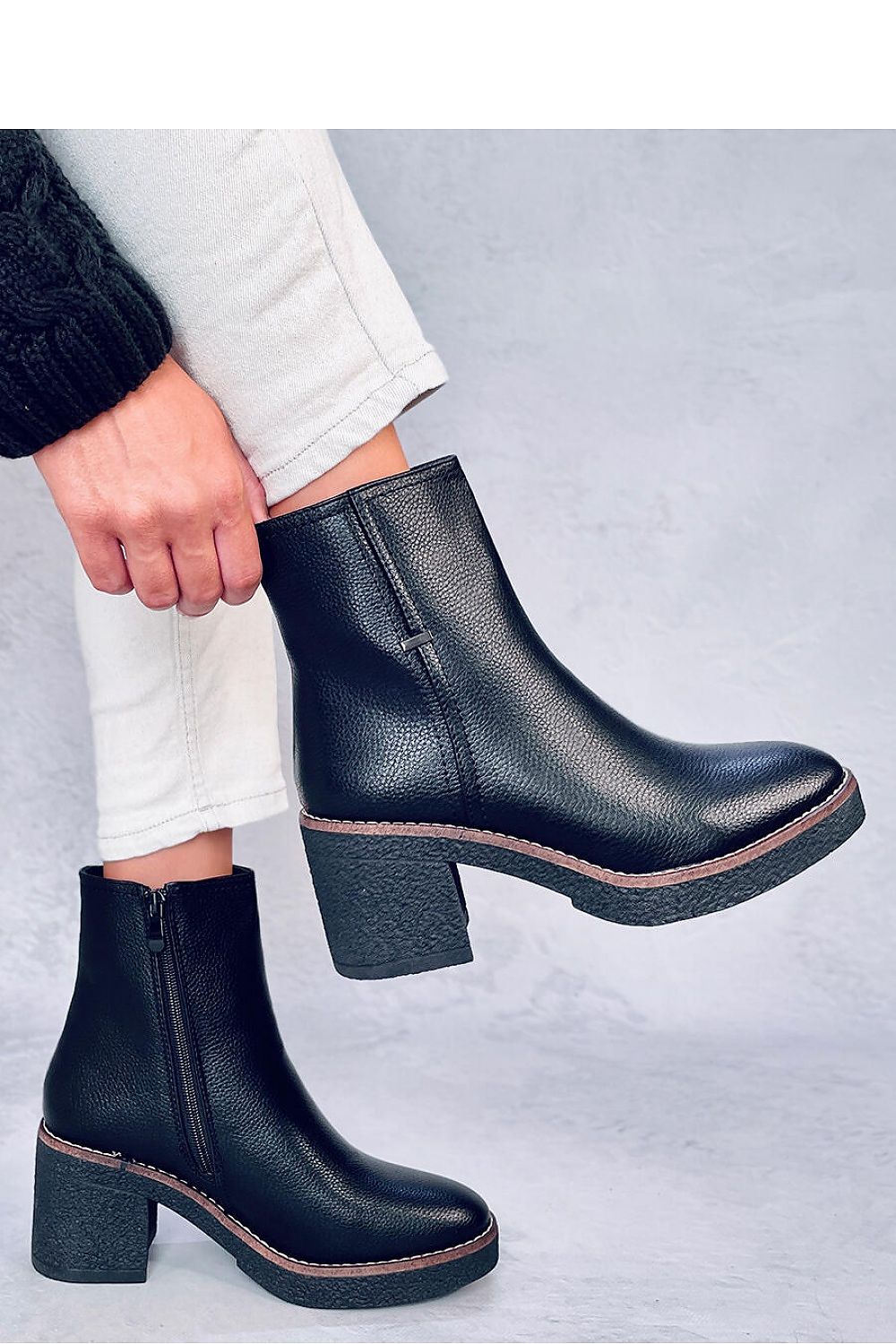 Elegant Inello Women's Classic Heel Boots designed with a 7 cm rubber heel, made from premium organic leather, complemented by a plush soft fur interior for ultimate comfort.