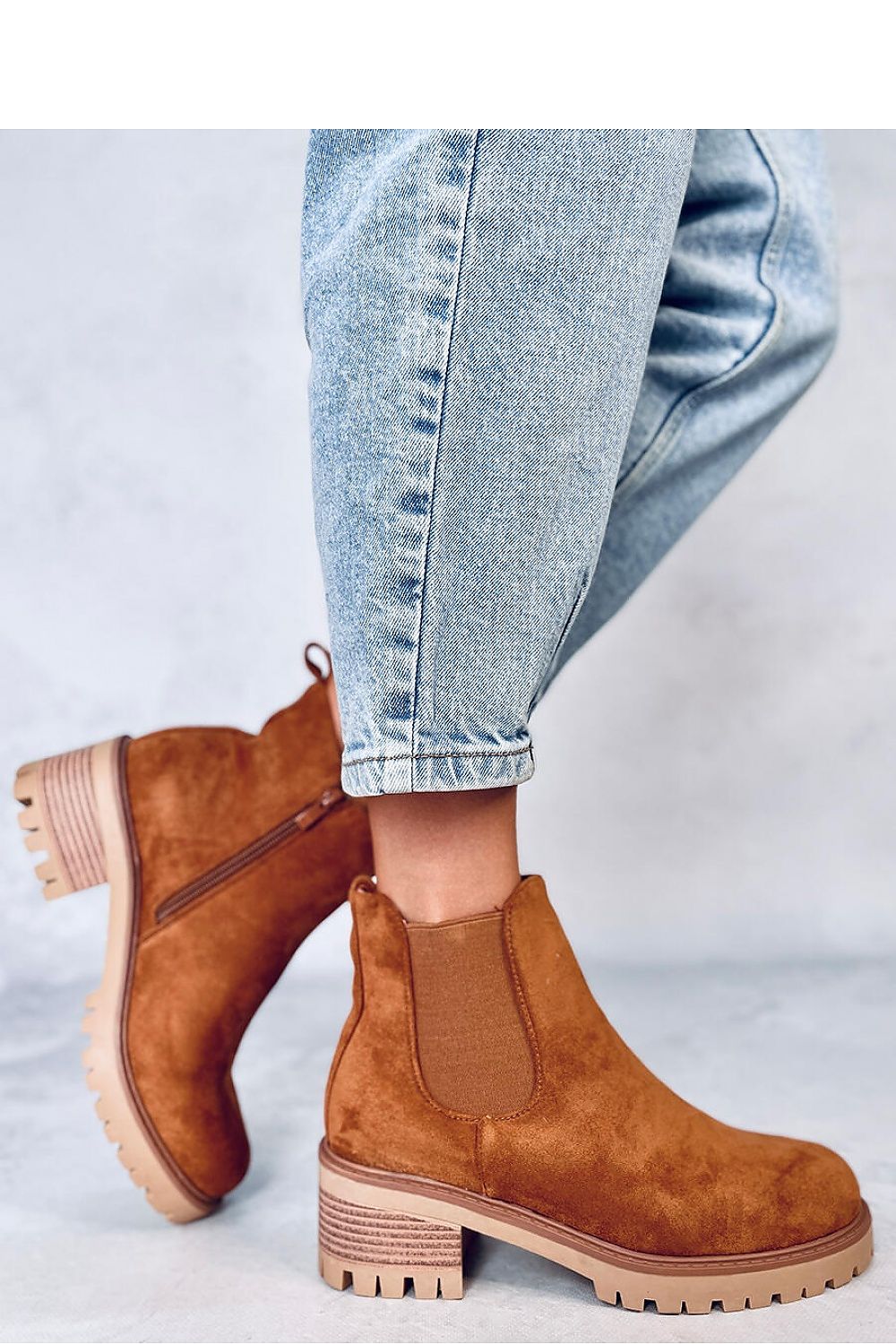 Stylish Inello women's booties showcasing a classic design with a practical zipper closure and protector sole, crafted from eco-friendly suede.