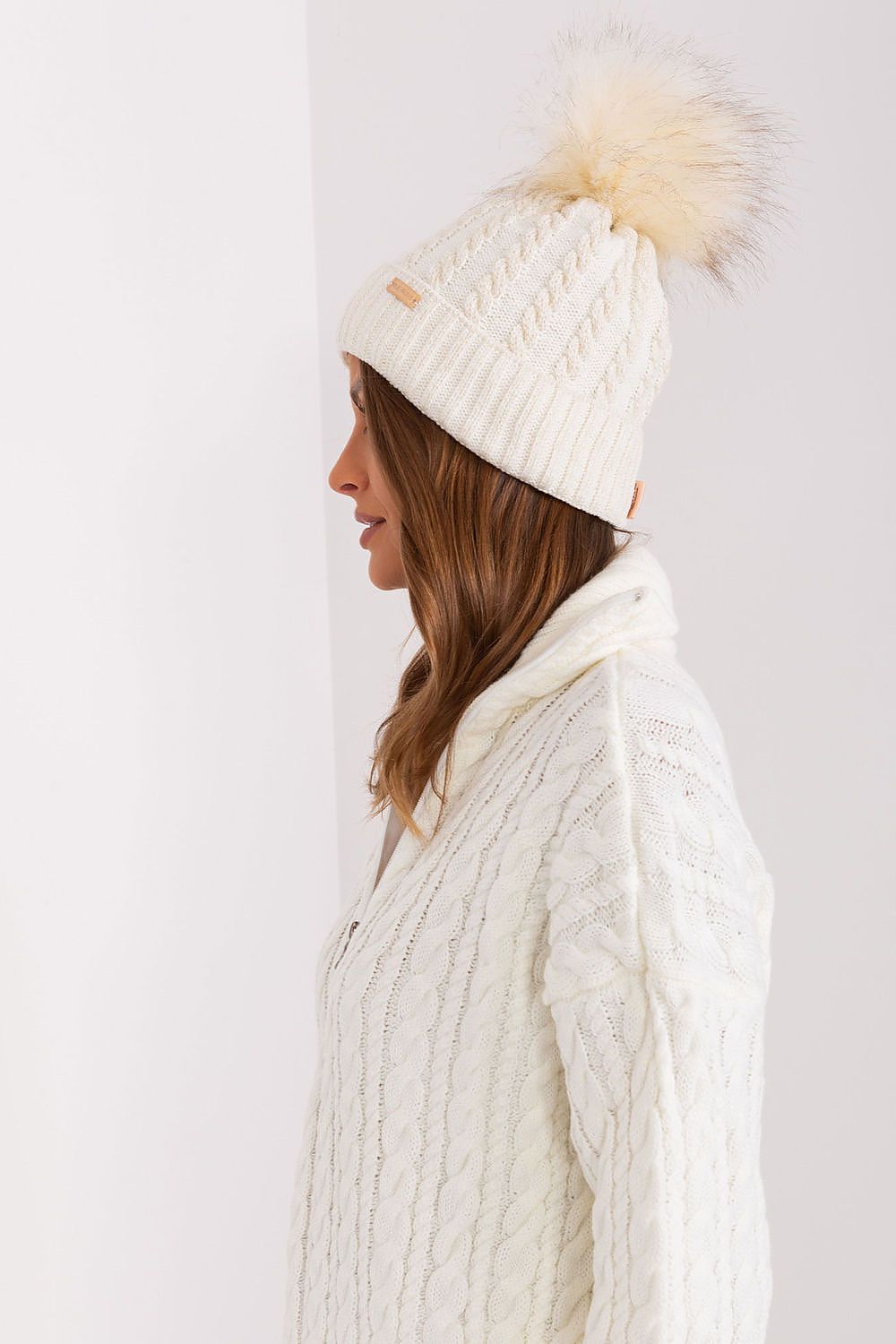Fashionable luxury women's winter beanie by Rue Paris, designed with a chic turn-up style, plaid texture, and a delightful pom-pom, made from soft acrylic and wool blend.