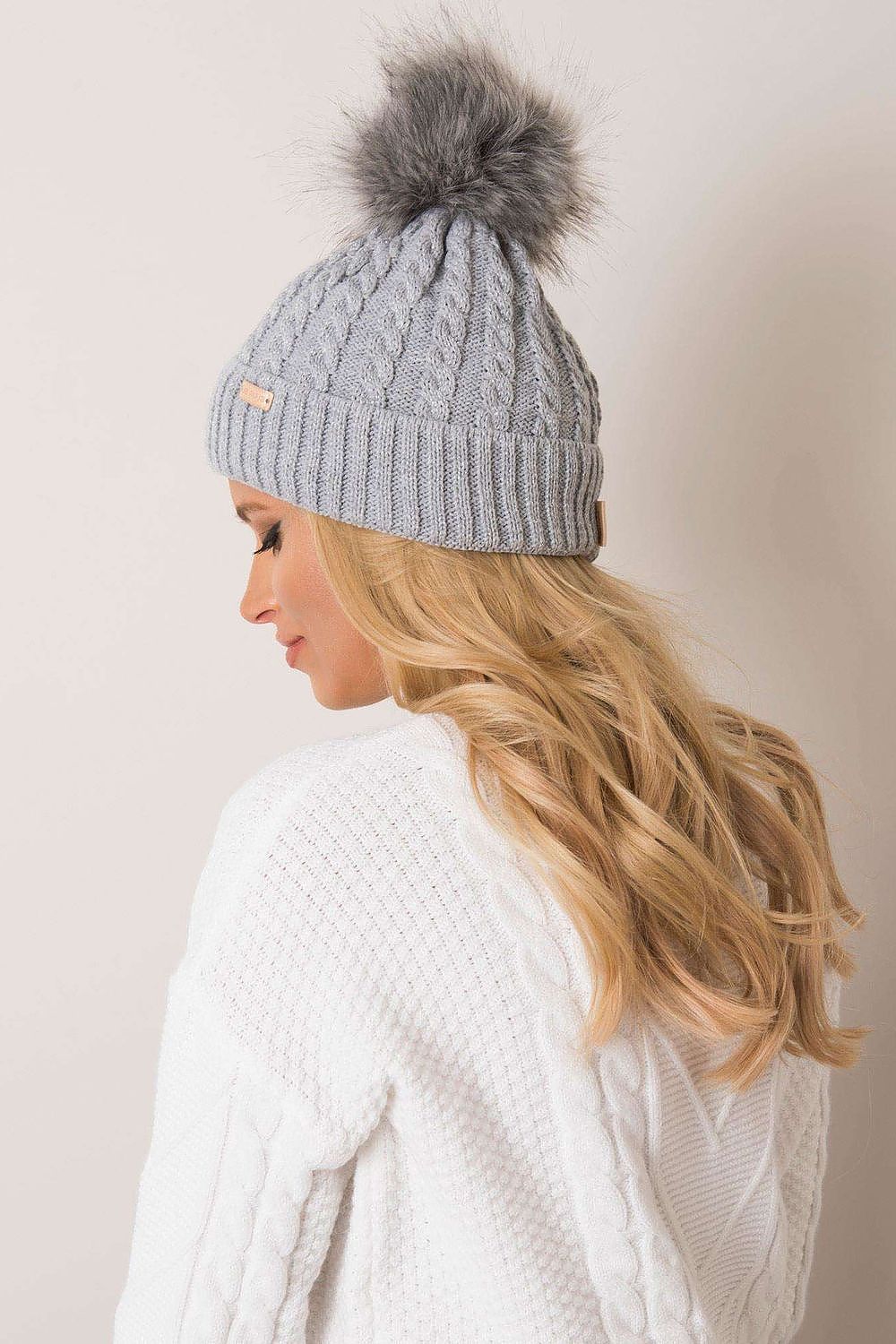 Luxury women's winter beanie with turn-up, plaid weave, and pom-pom by Rue Paris, showcasing high-quality 70% acrylic and 30% wool fabric.