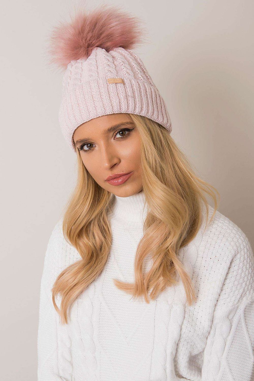 Close-up of Rue Paris luxury women's winter beanie, highlighting the intricate plaid weave and stylish pom-pom detail.