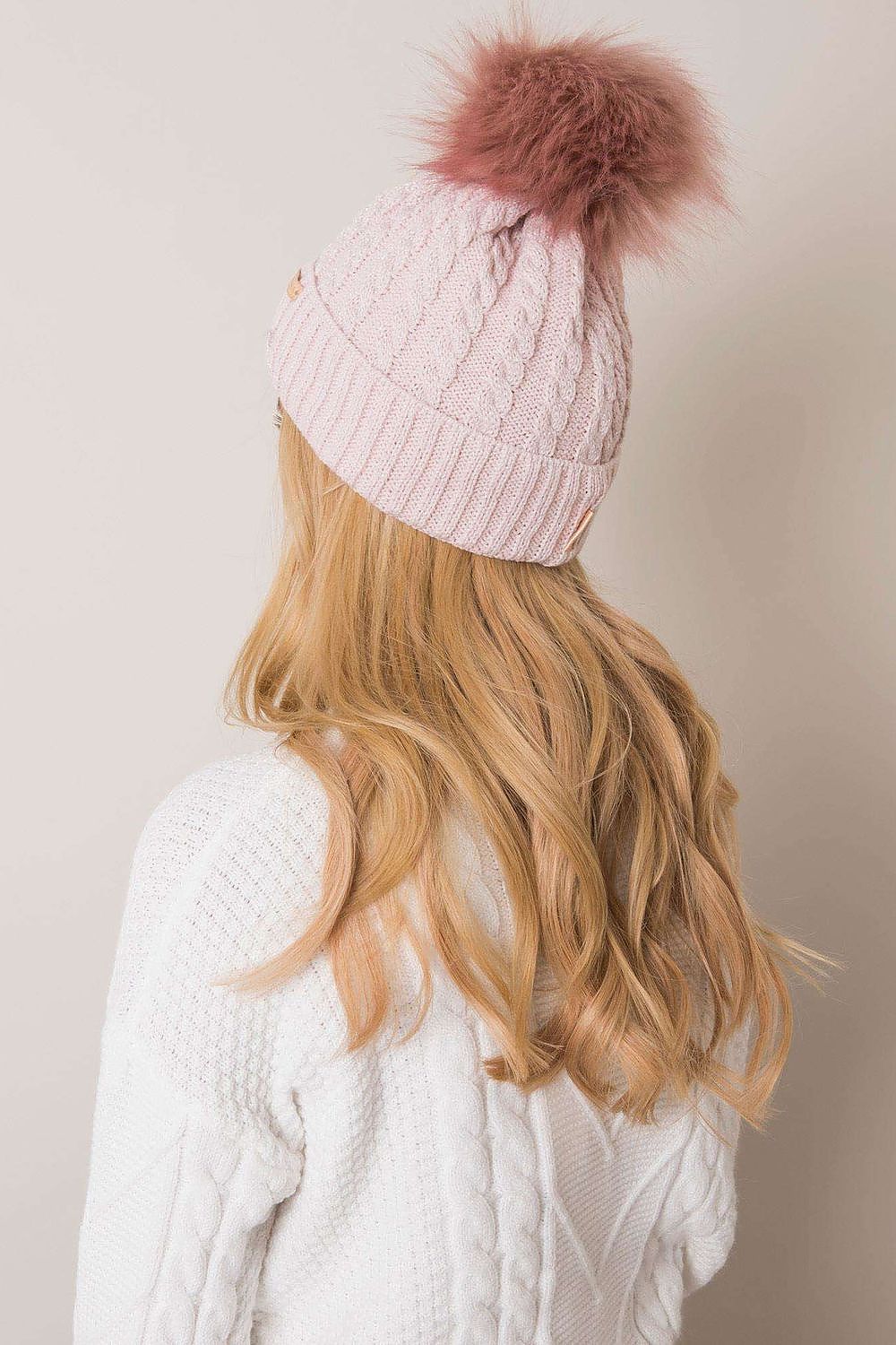 Elegant winter scene featuring Rue Paris women's winter beanie with turn-up and cozy pom-pom, perfect for chic cold-weather style.