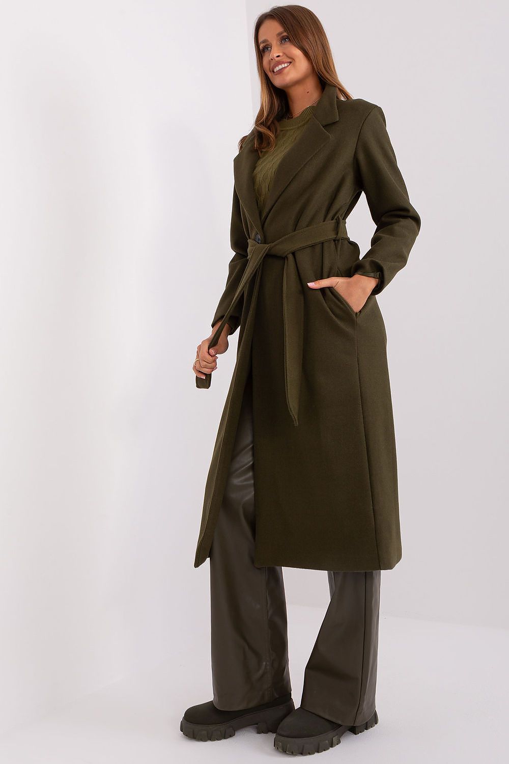 Side view of the Och Bella transitional coat highlighting its sleek design and practical slip pockets.