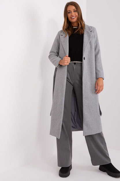 Model wearing the Och Bella long transitional coat in a casual setting, showcasing its elegant design and comfort.