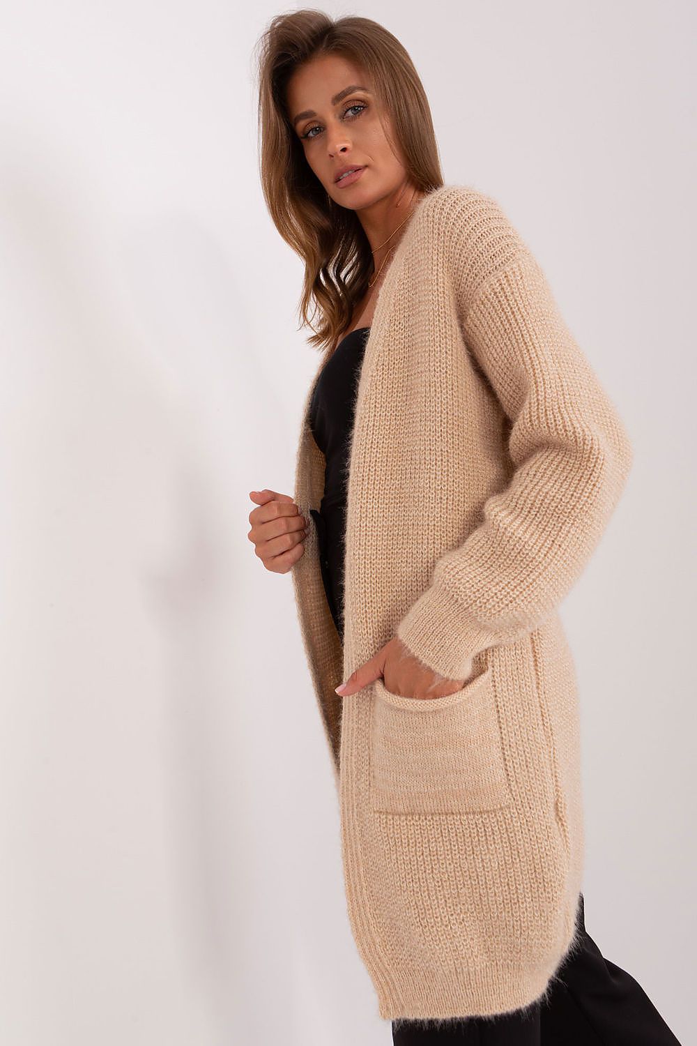 Elegant Italy Moda Acrylic Cardigan featuring warm long sleeves, slip pockets, and knee-length design for luxurious casual style.