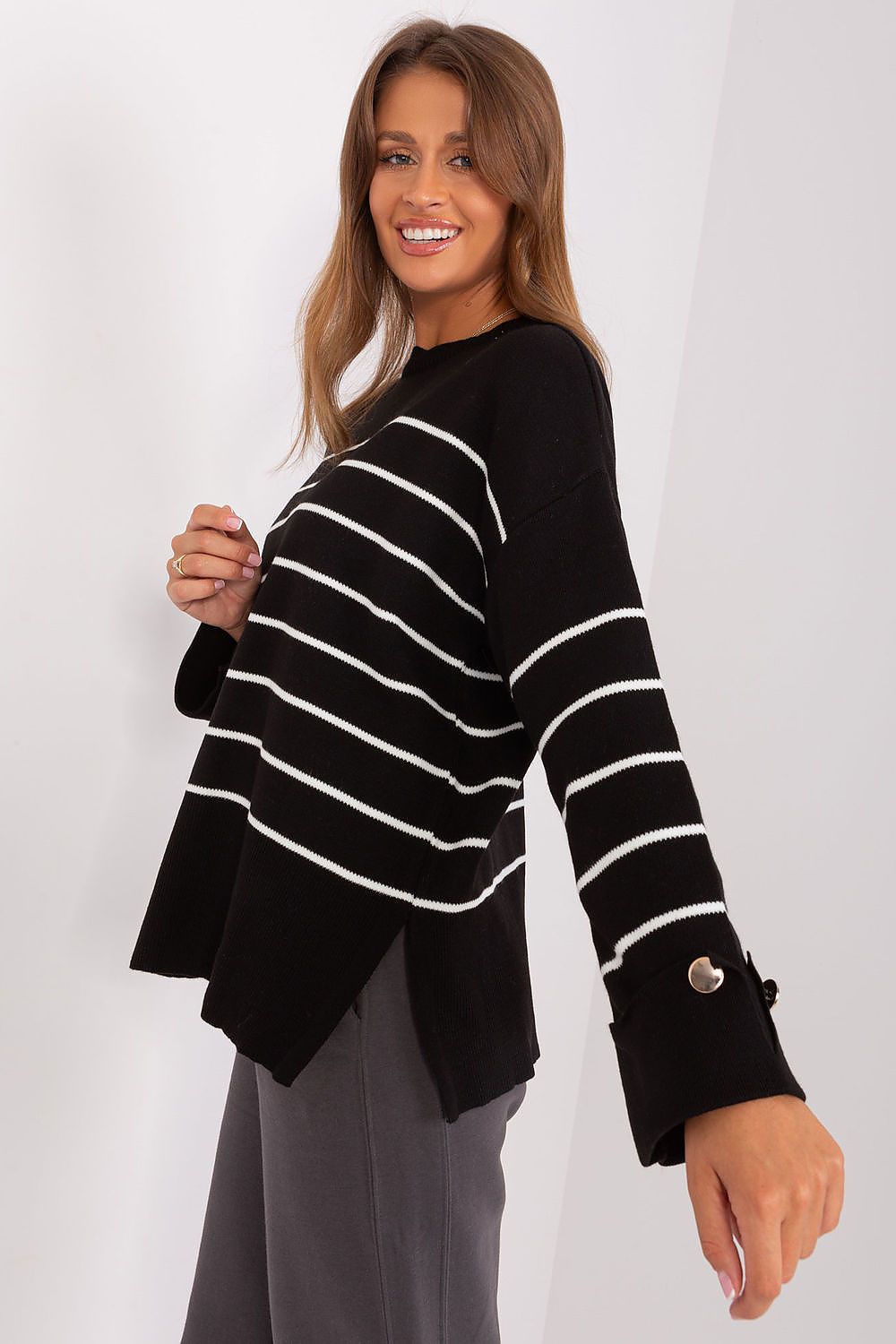 Model wearing a luxury casual striped sweater by Factory Price, demonstrating its versatility for various outfits and chic everyday style.