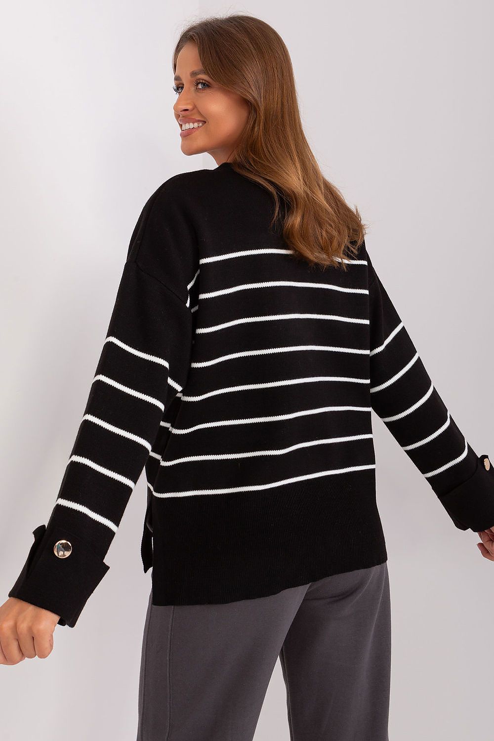 Elegant model showcasing the Luxury Casual Striped Sweater by Factory Price, featuring a chic round neckline and decorative buttons, perfect for stylish everyday wear.