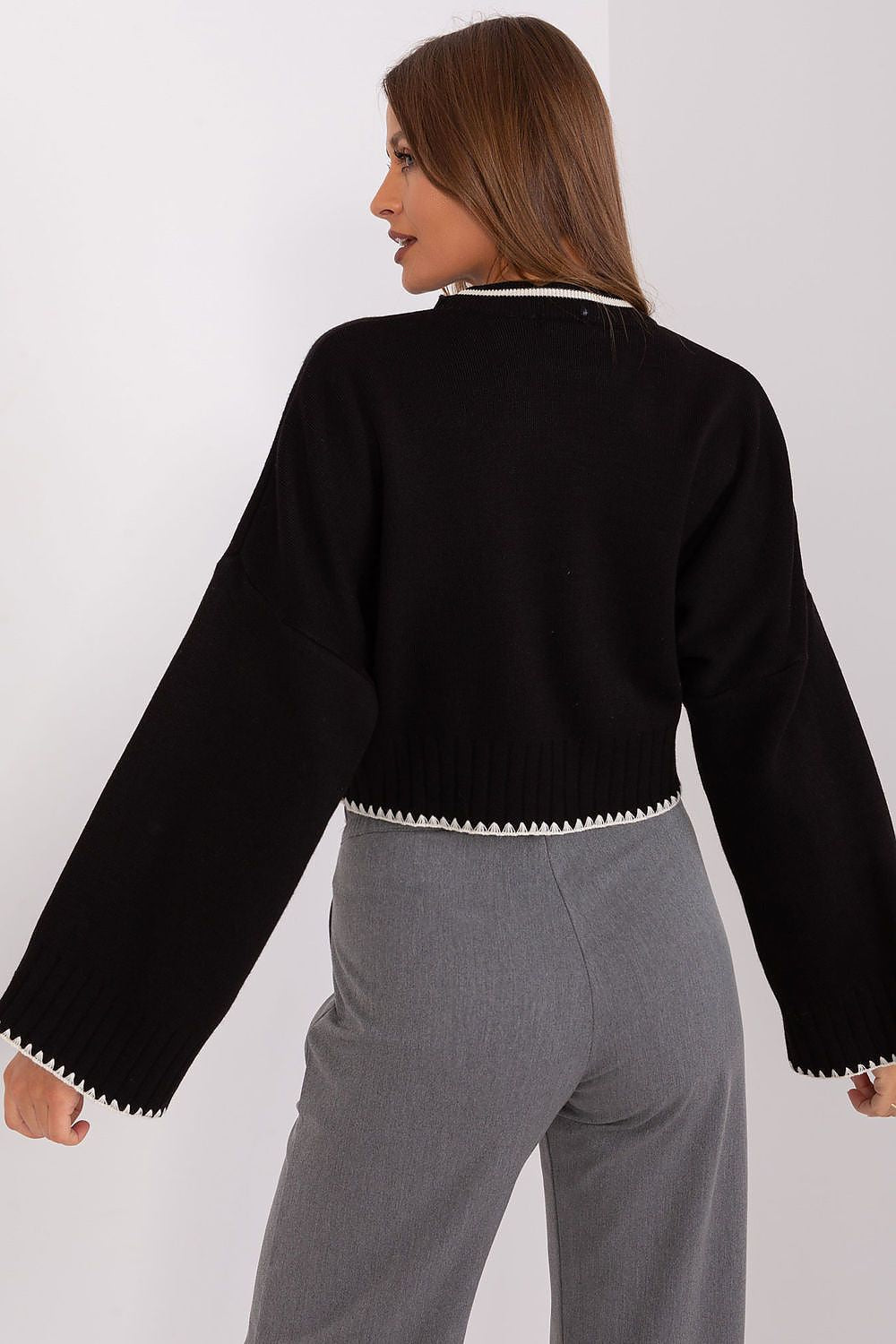 Luxurious 100% acrylic short sweater with fashionable wide sleeves by Factory Price, designed for everyday elegance and comfort.