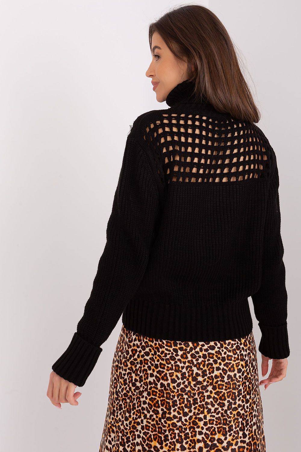 Woman wearing the Luxury 100% Acrylic Turtleneck Sweater by Factory Price, exuding sophistication and warmth in a winter setting.