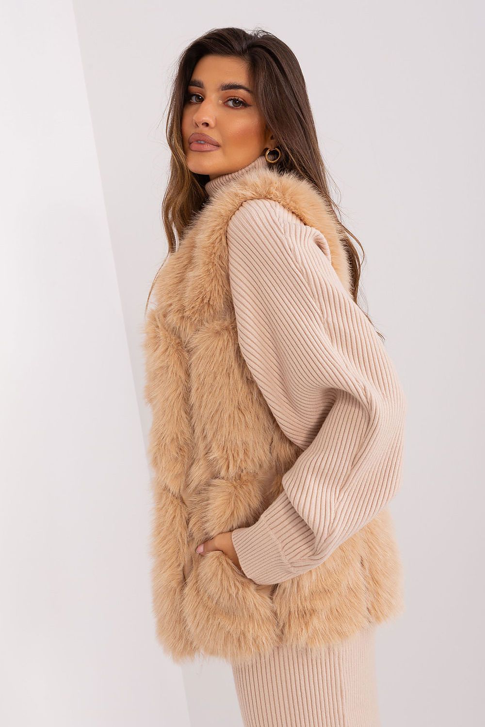 Elegant polyester fur vest by AT featuring slip pockets and hook-and-loop closure, perfect for sophisticated styling in fall, winter, or spring.