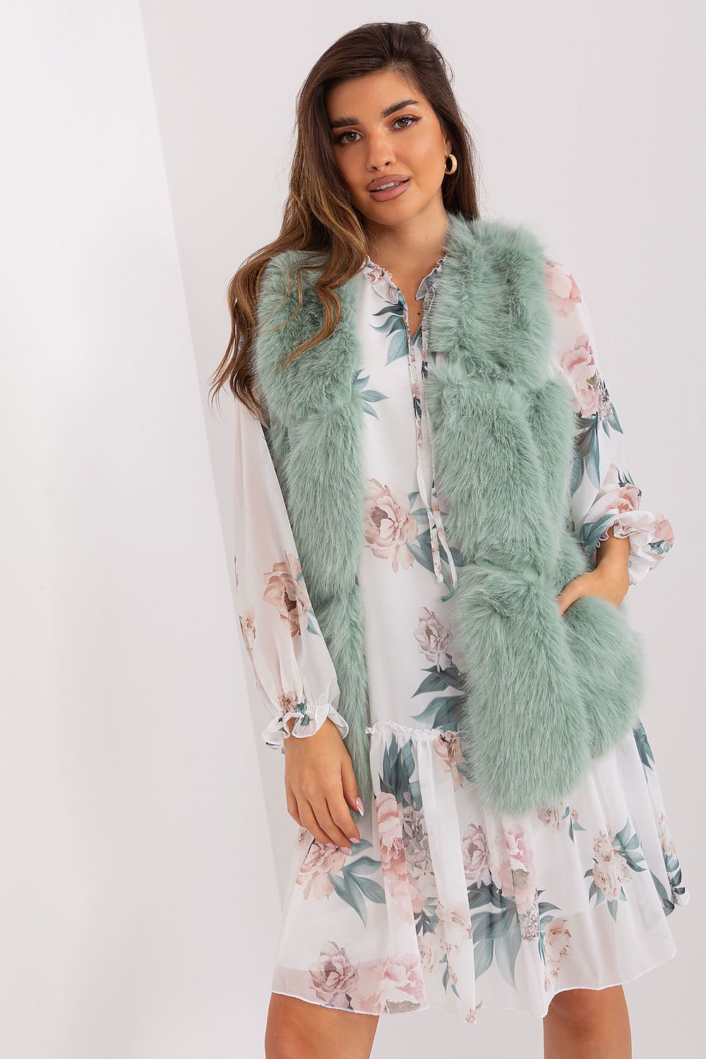 Sophisticated polyester fur vest by AT that combines luxury and comfort, featuring a standard length and convenient slip pockets for everyday elegance.