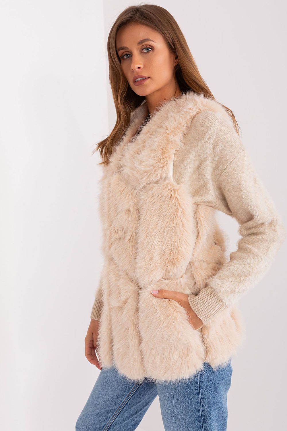 Elegant polyester fur vest by AT, featuring slip pockets and a sophisticated hook-and-loop closure, perfect for stylish layering in autumn and winter.