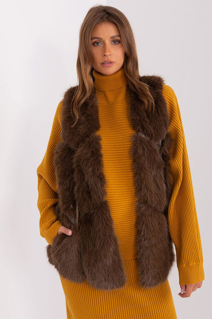 Luxurious polyester fur vest by AT featuring slip pockets and a hook-and-loop closure, perfect for elegant fall and winter styling.