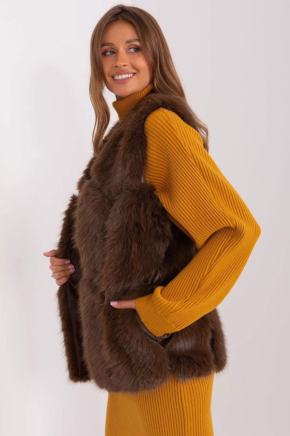 Chic and sophisticated AT polyester fur vest, showcasing a refined design with convenient slip pockets for modern versatility.