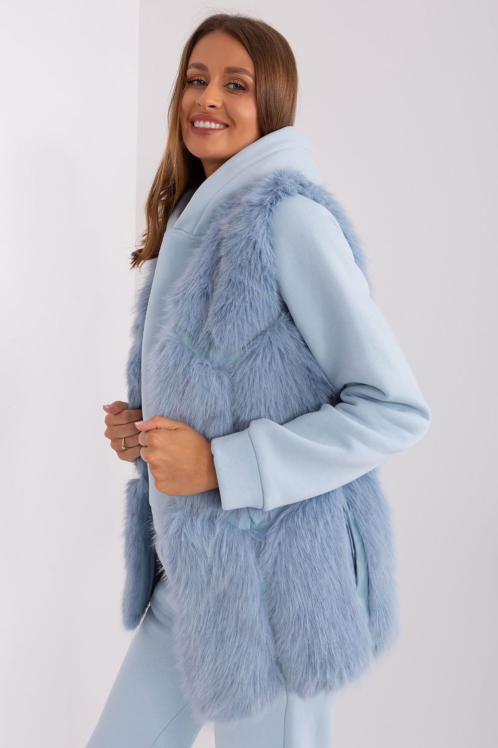 Timeless polyester fur vest by AT, offering a classic look with added comfort and sophisticated details, ideal for layering.