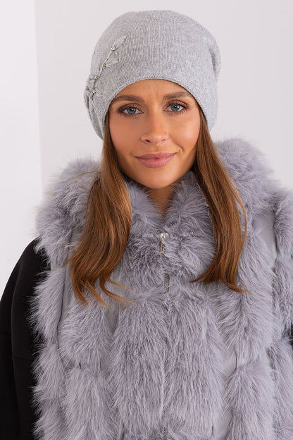Stylish winter hat for women by AT, crafted in a blend of acrylic, cotton, and cashmere with exquisite applique detailing.