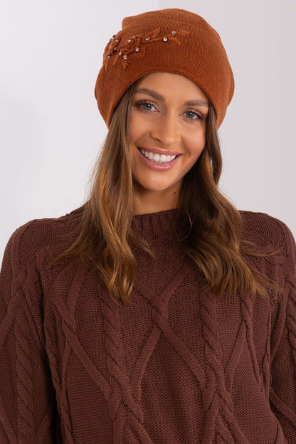 Beautiful women's winter hat from AT, featuring a comfortable fit made of acrylic, cotton, and cashmere blend with stylish applique.