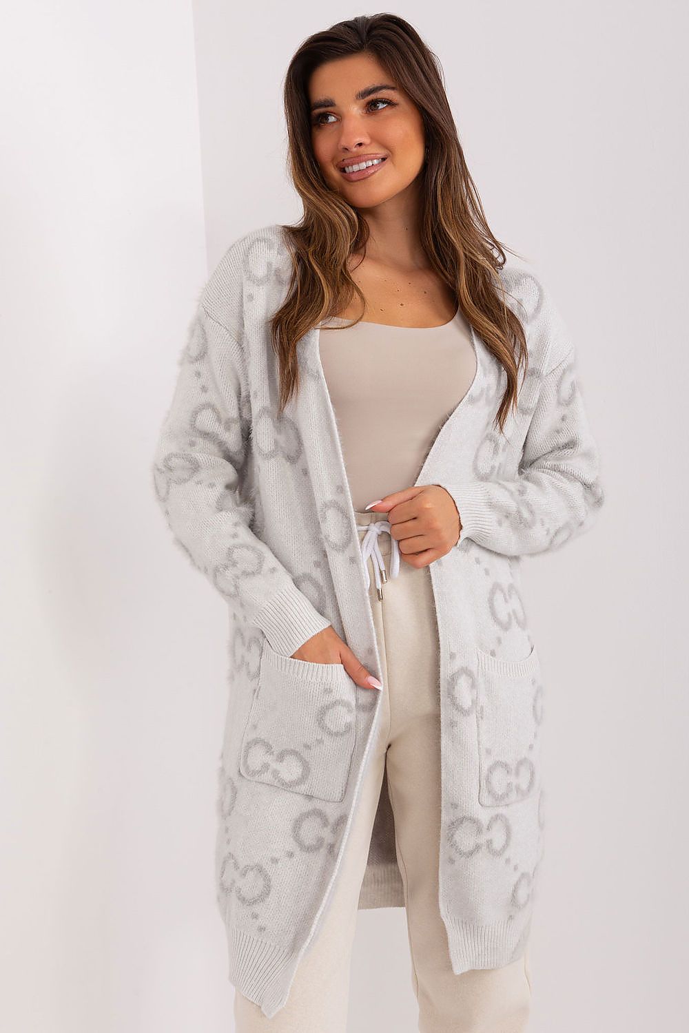 Elegant long sleeve cardigan with pockets by AT, showcasing a nylon blend fabric for luxurious comfort and style.