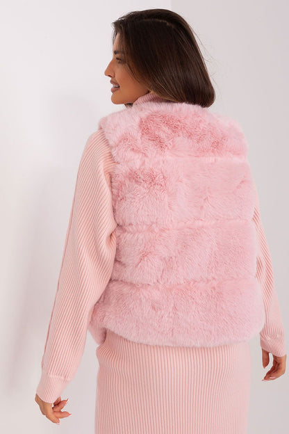 Soft and sophisticated fur vest by AT, featuring a stylish silhouette and accessible pockets for an upscale casual look.