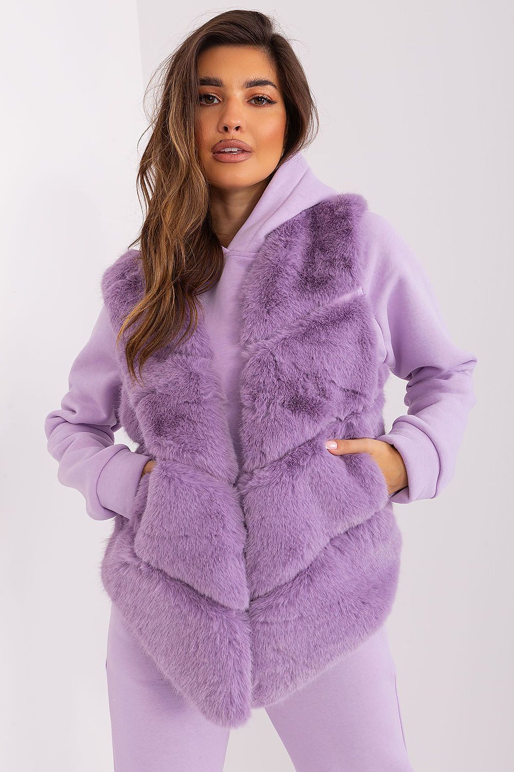 Elegant styling of the AT Women's Fur Vest, designed with functional pockets and a comfortable fit for utmost luxury.