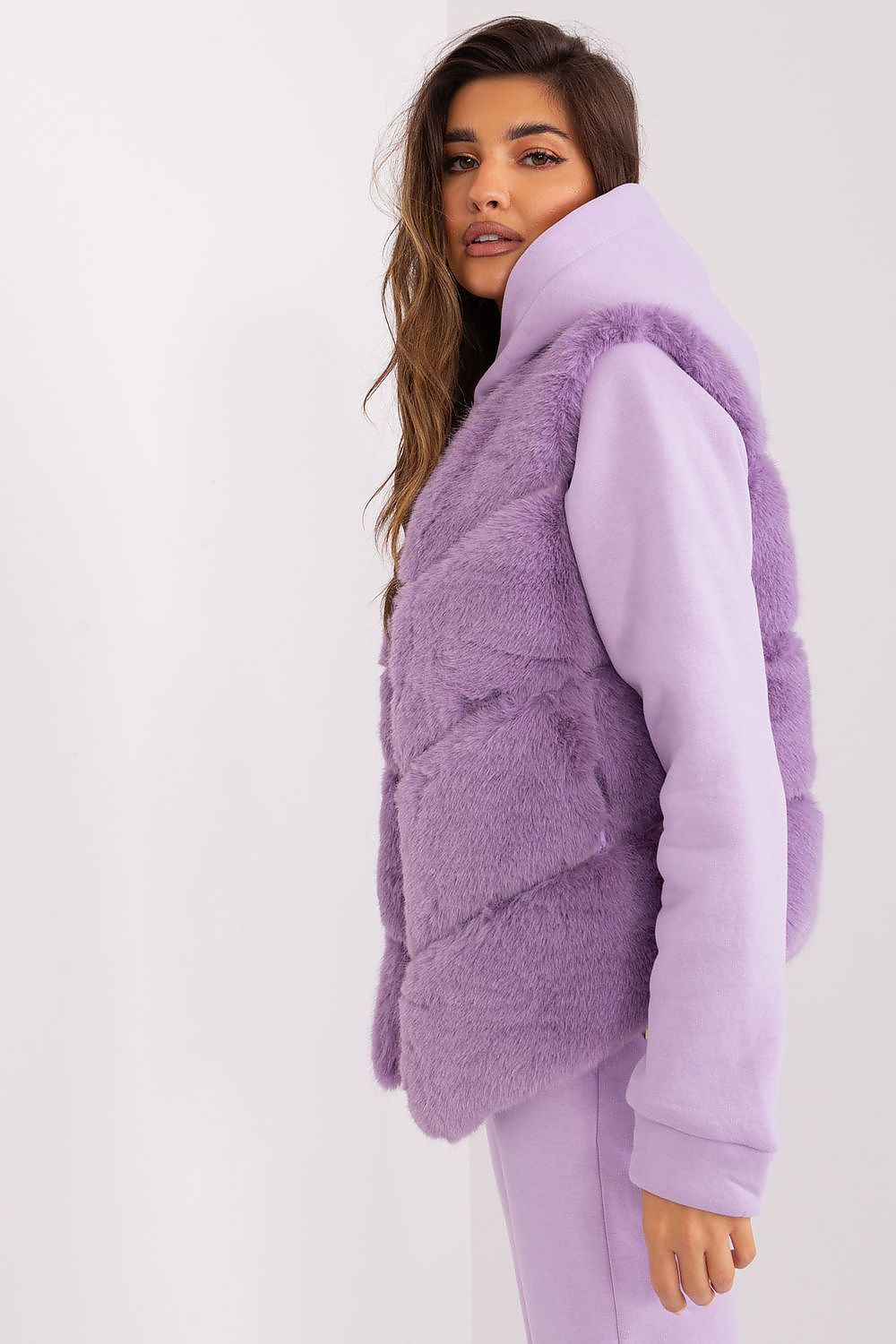 The luxurious interior lining of the AT Women's Fur Vest, showcasing comfort and elegance for colder days.