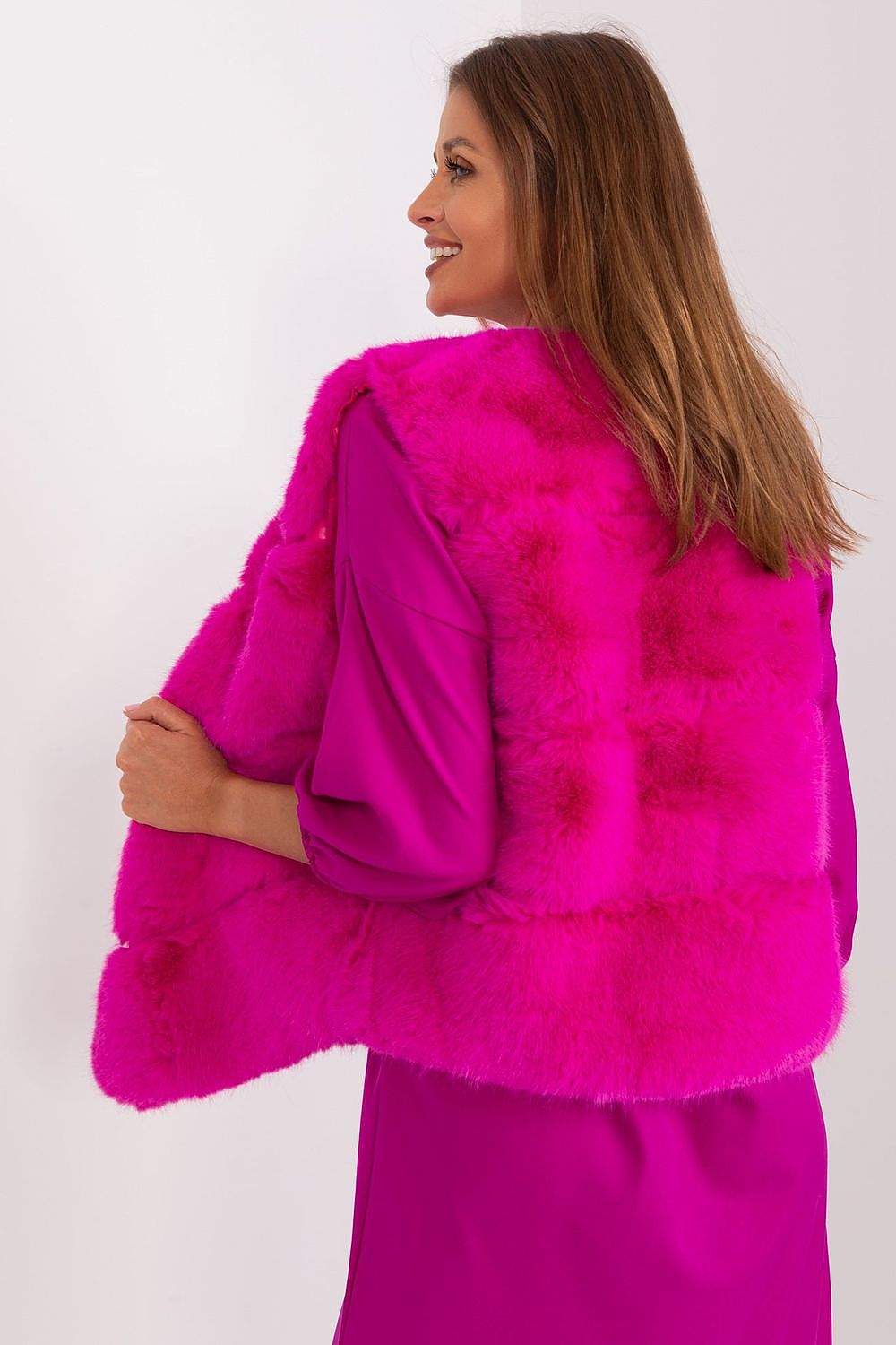 Sophisticated fur vest by AT, easy to wear with hook-and-loop fasteners, enhancing any outfit with warmth and style.