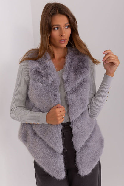 Versatile luxury women's gilet by AT, highlighting the practicality of pockets and elegant design for cooler days.