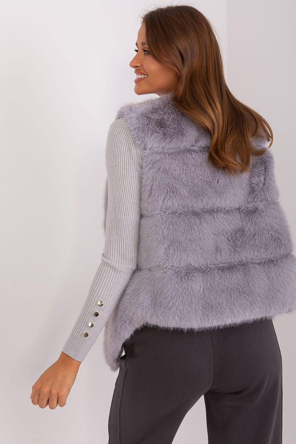 Luxury Women's Fur Vest by AT, showcasing its soft polyester fabric and elegant design with functional pockets for casual sophistication.