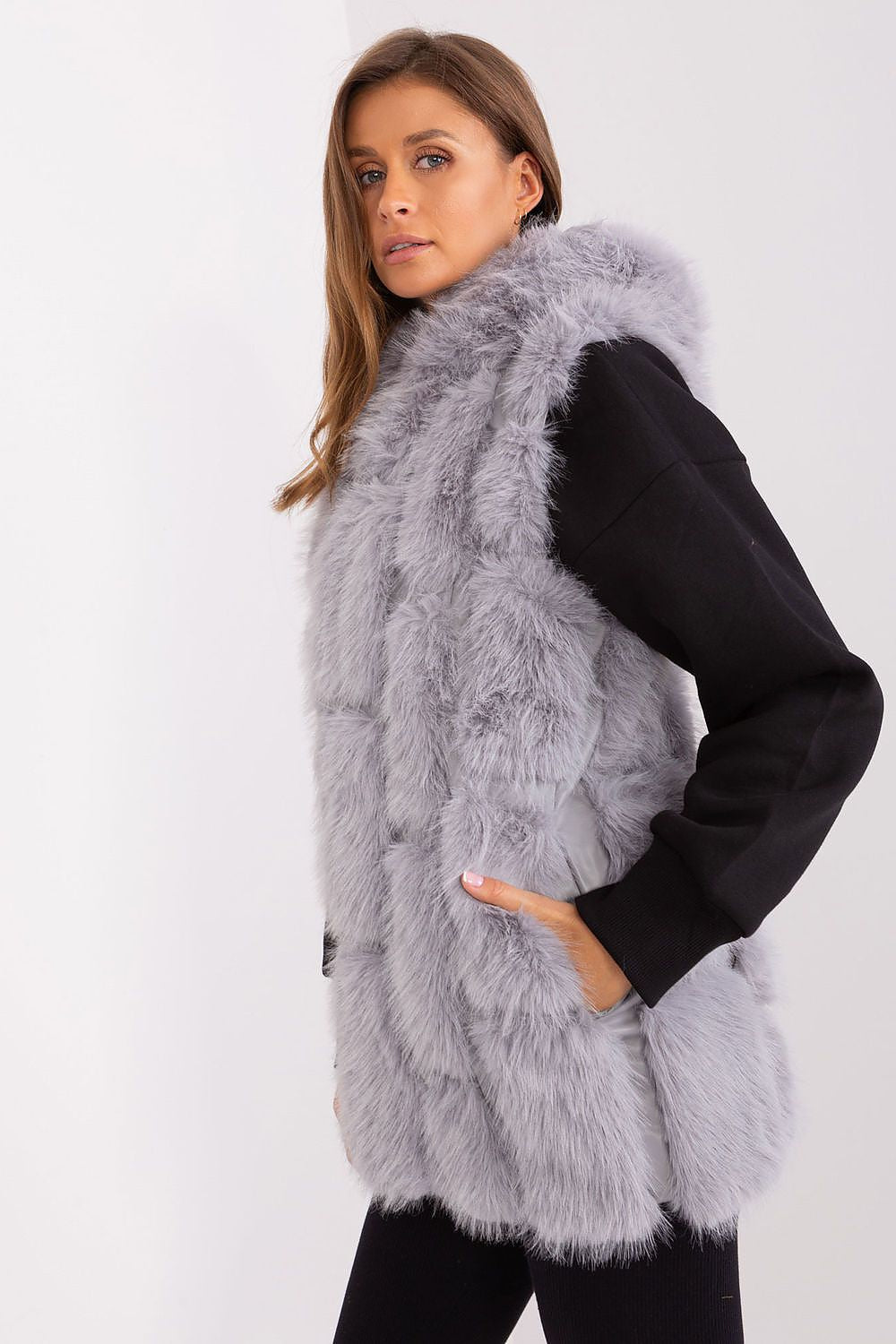 Close-up of the Elegant Women's Fur Vest by AT, highlighting the soft polyester texture and beautiful hood feature.