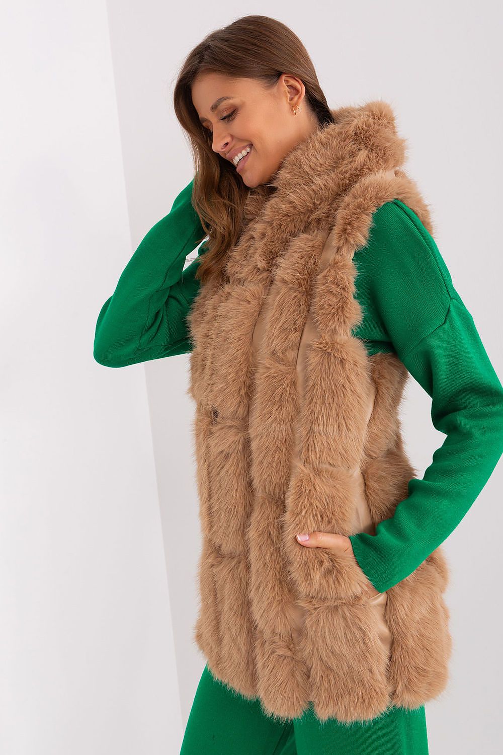 Casual outfit featuring AT's elegant fur vest with hood, ideal for transitional weather and stylish outings.