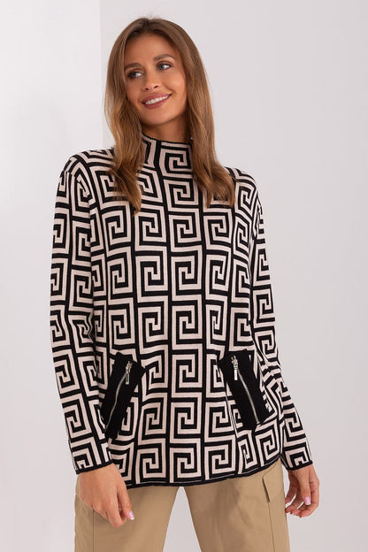 Trendy AT women's sweater featuring zippered pockets and a striking geometric pattern, ideal for stylish everyday wear.