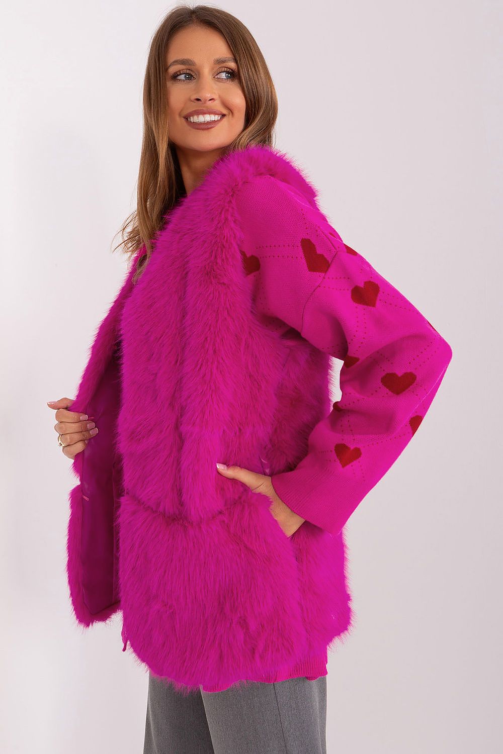 Sophisticated polyester fur vest with practical pockets, designed by AT for a chic winter look.