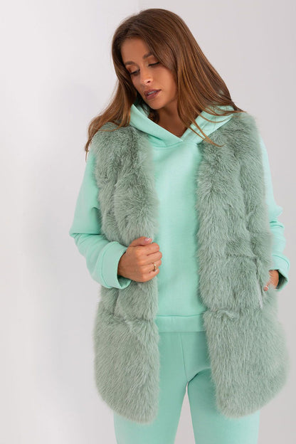 Elegant, easy-to-wear polyester fur gilet from AT, offering both comfort and glamour for autumn occasions.