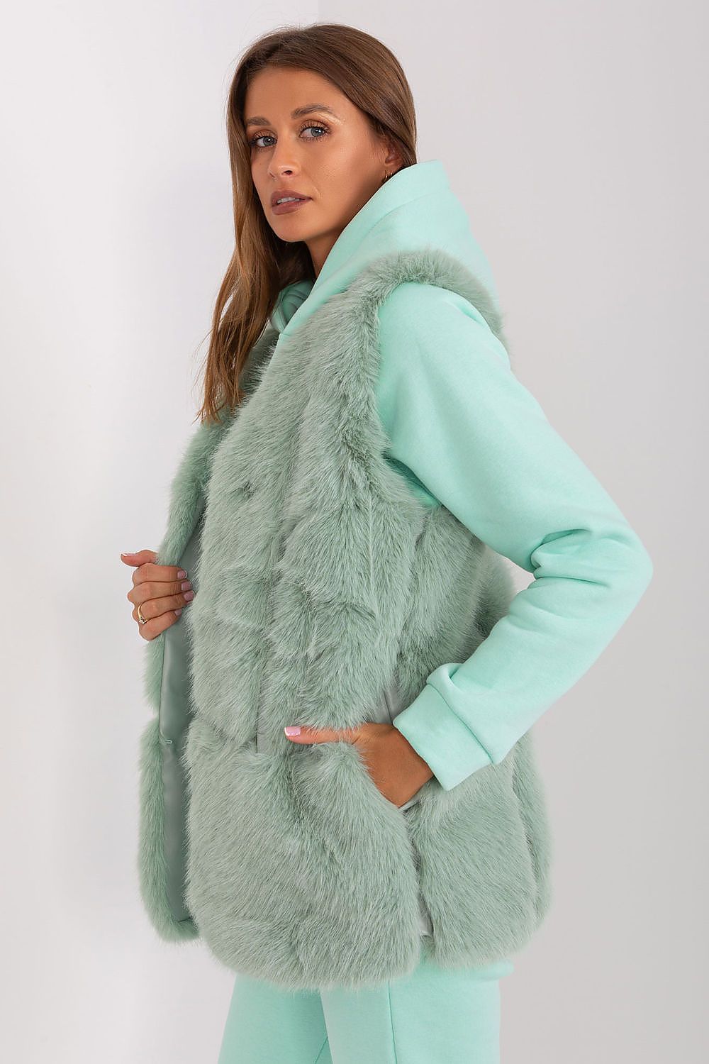 Luxurious polyester fur vest with pockets by AT, perfect for autumn and winter styling.