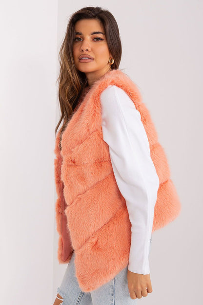 Stylish ensemble featuring the Women's Fur Vest by AT, demonstrating its versatility for casual elegance and warmth during special occasions.