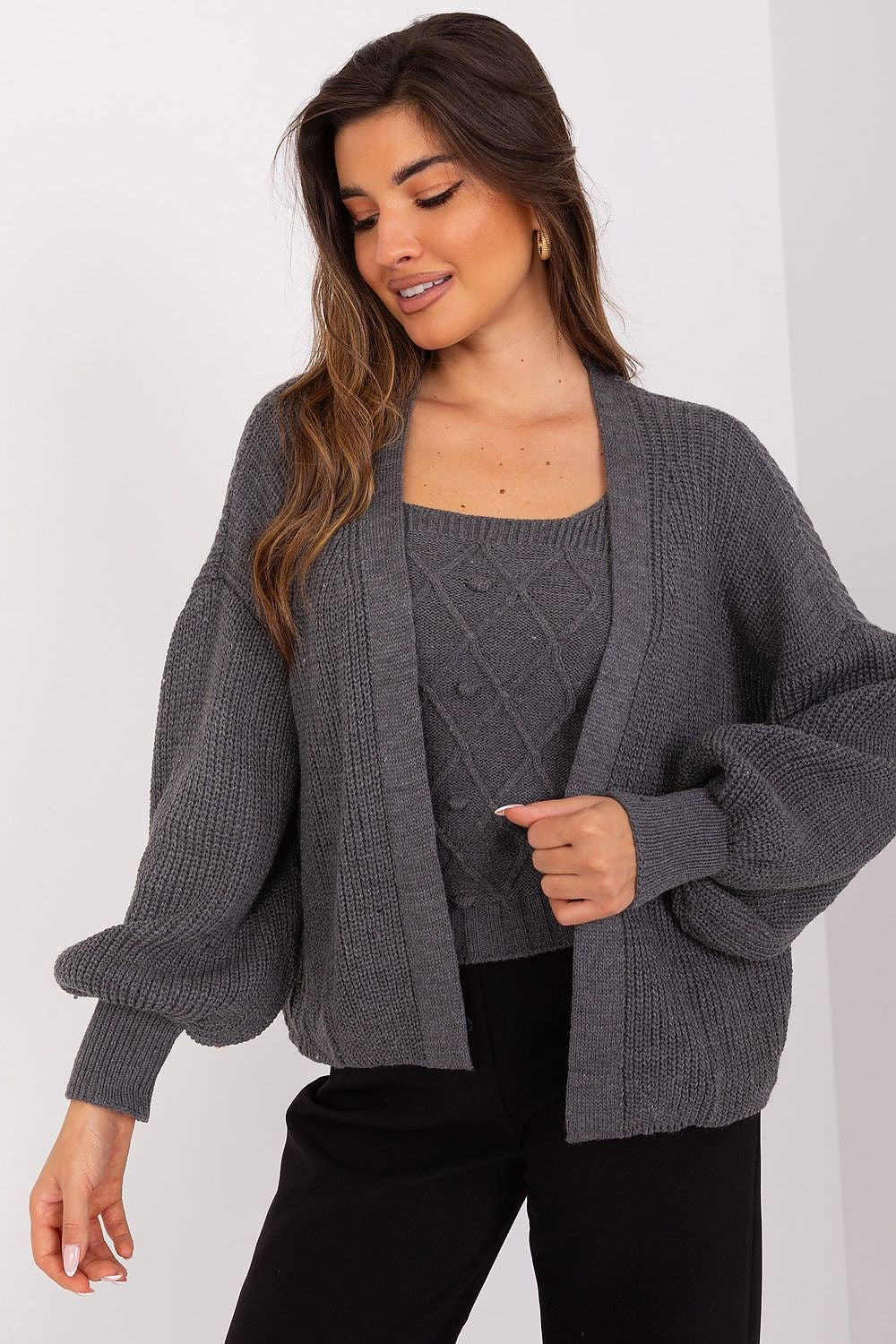 Elegant Badu cardigan set featuring a strapless top and long buff sleeves, perfect for stylish comfort on various occasions.